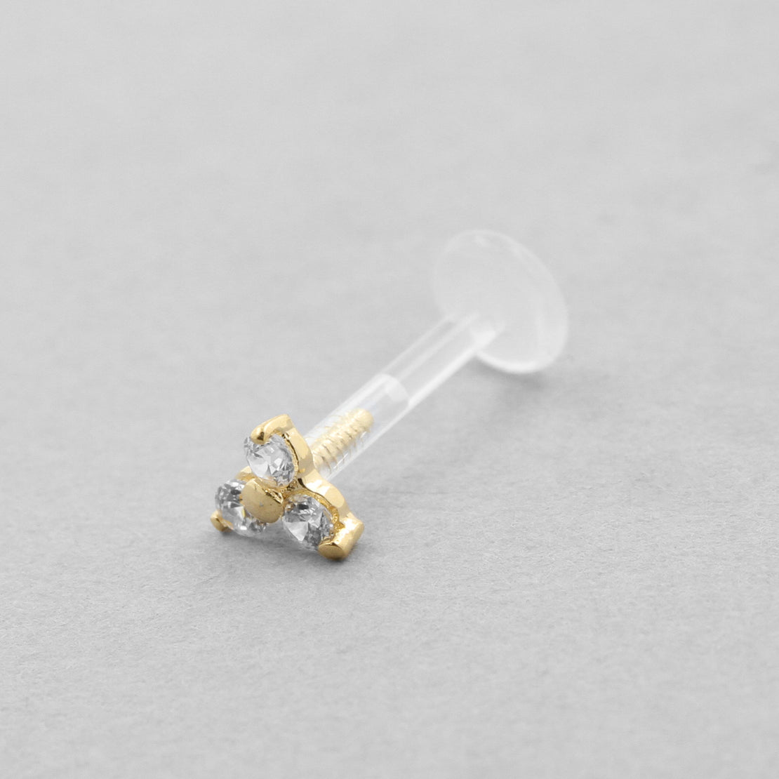 18 Karaats Goud Bioplast Labret Met Gouden Zirkonia Trinity